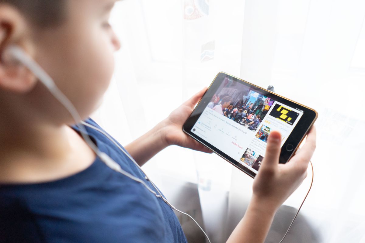 Photo by Atlantic Ambience on Pexels A parent workspace with a tablet and notes - Photo by Atlantic Ambience on Pexels