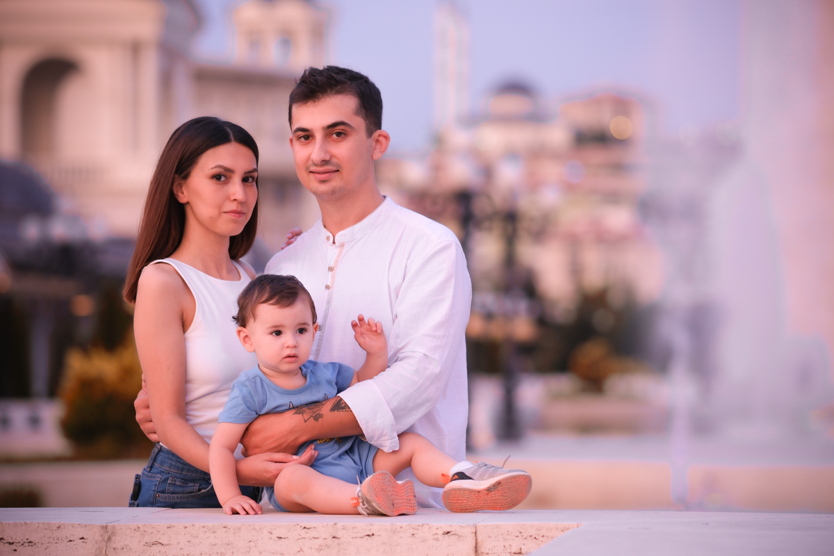 Charming family enjoying a day outdoors in Ankara, capturing delightful emotions. Charming family enjoying a day outdoors in Ankara, capturing delightful emotions.