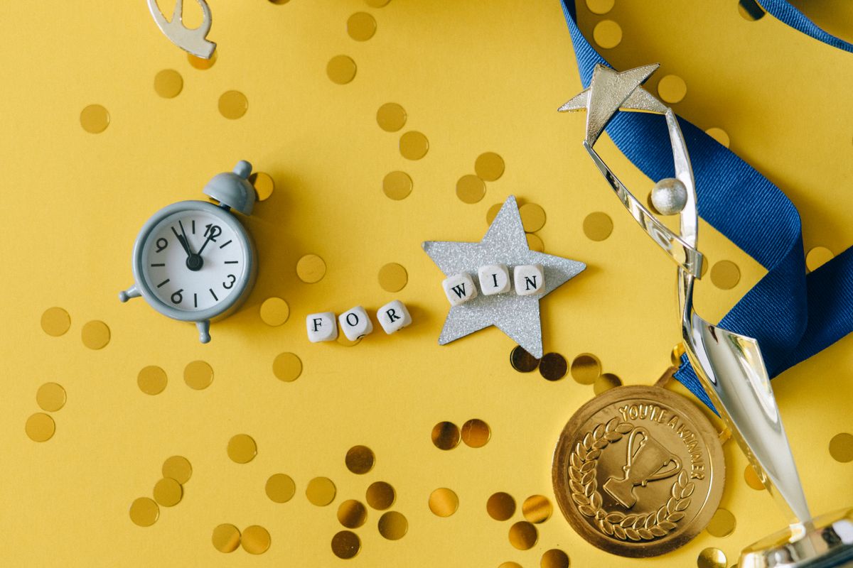 Photo by Nataliya Vaitkevich on Pexels A trophy and medal reward flat lay - Photo by Nataliya Vaitkevich on Pexels
