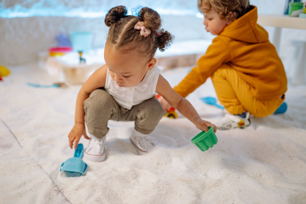 Photo by Yan Krukau on Pexels Two kids enjoying a fun indoor sand play session with colorful toys. - Photo by Yan Krukau on Pexels