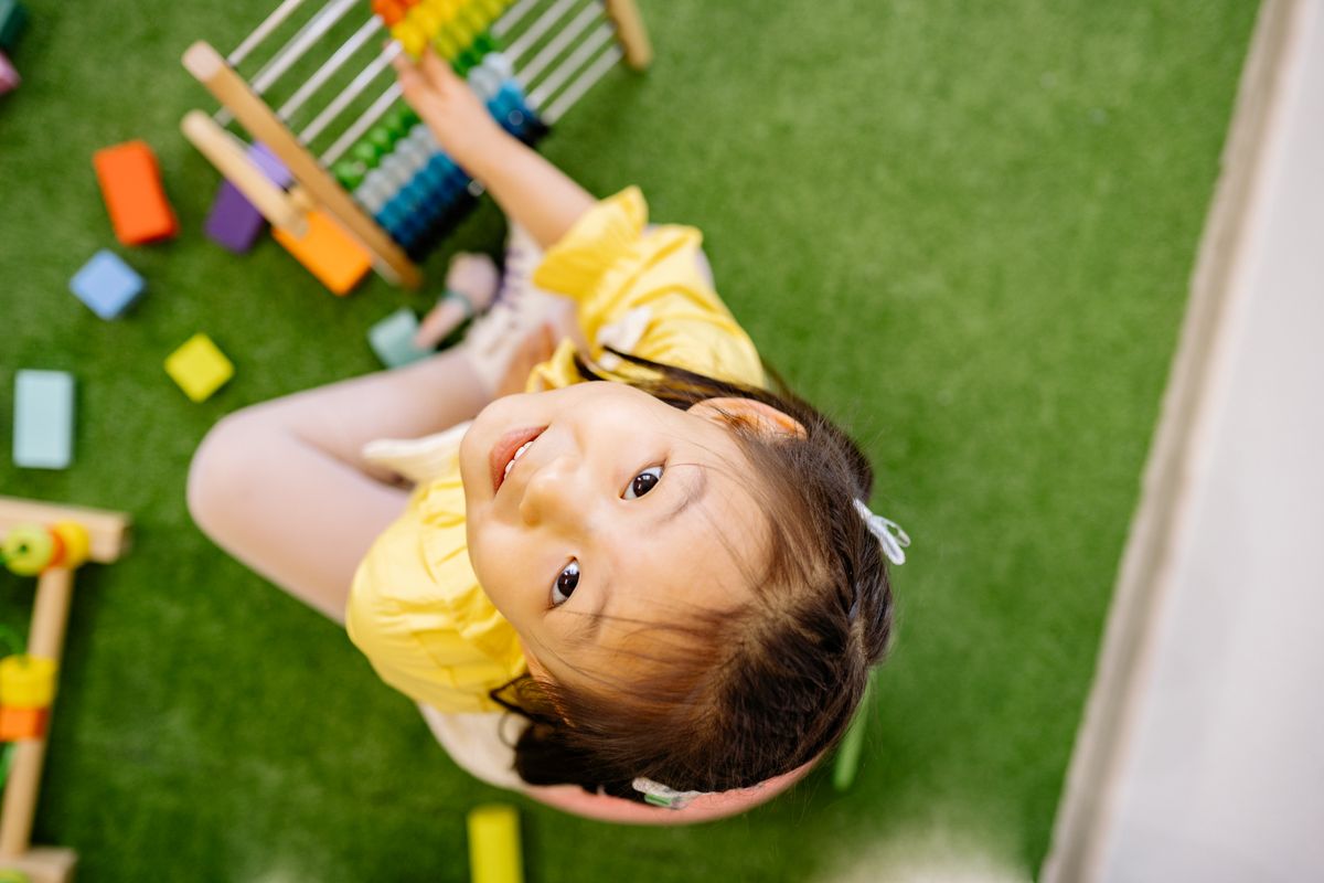 Photo by Yan Krukau on Pexels Happy child playing with abacus indoors. Perfect for educational and playful themes. - Photo by Yan Krukau on Pexels